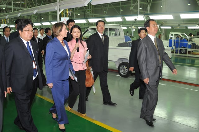 US Congresswoman Nancy Pelosi visiting a Tianjin electric car factory in 2009