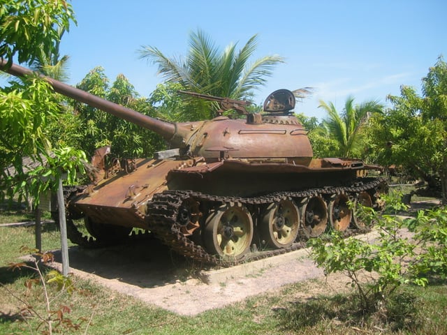 A memorial of a T-54/Type 59 tank in Siem Reap, Cambodia, commemorating the overthrow of US/RVN-backed Lon Nol and the end of the civil war by the NVA and GRUNK
