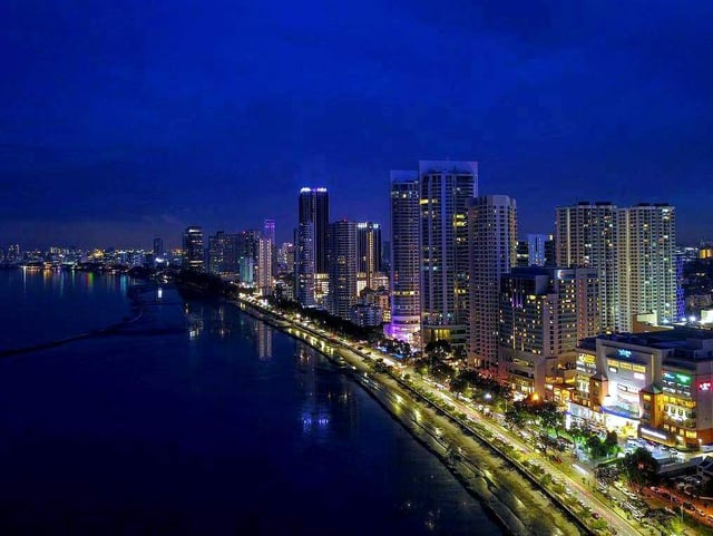 Skyscrapers along Gurney Drive and Northam Road at dusk