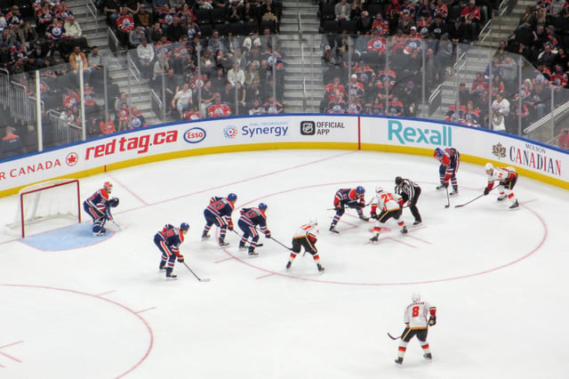 A ice hockey game between the Calgary Flames, and the Edmonton Oilers, two teams in the National Hockey League