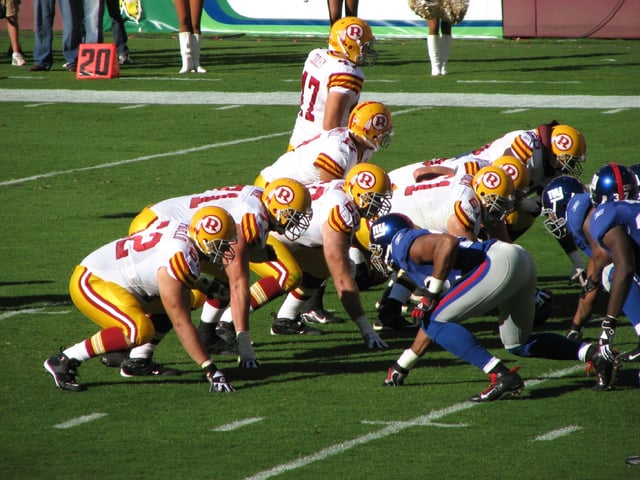 The Redskins gather at the line of scrimmage against the New York Giants