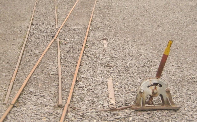 A narrow gauge stub switch. (A further example of a stub switch is shown at "Three way switch" below.) Note that this switch has an additional piece of movable rail instead of a frog.