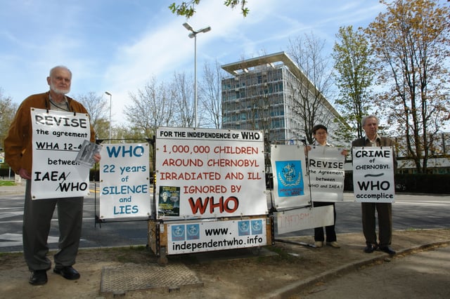 Alexey Yablokov (left) and Vassili Nesterenko (farthest right) protesting in front of the World Health Organization headquarters in Geneva, Switzerland in 2008.