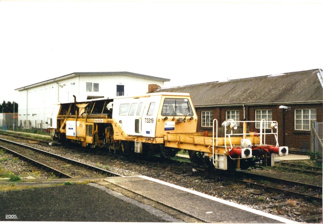 A Carillion Rail ballast/track tamper train at Banbury railway station.