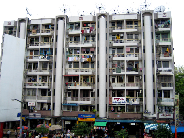 A block of flats in down-town Yangon, facing Bogyoke Market. Much of Yangon's urban population resides in densely populated flats.