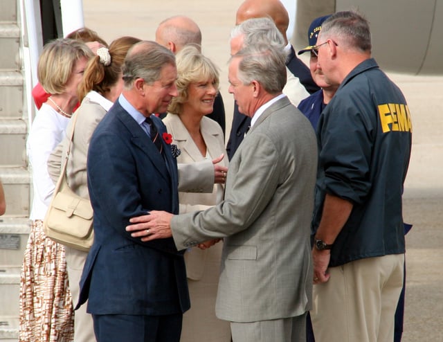 Prince Charles and Camilla are greeted by Federal Emergency Management Agency officials as they arrive to tour the damage created by Hurricane Katrina in New Orleans, November 2005