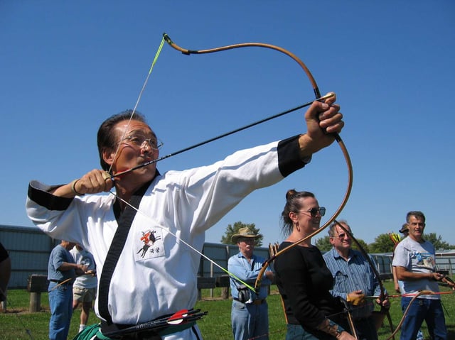 Master Heon Kim demonstrating Gungdo, traditional Korean archery (Kuk Kung), 2009