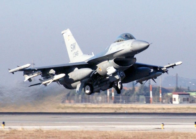 F-16CJ of the 20th Fighter Wing at Shaw AFB, South Carolina, armed with a mix of air-to-air missiles, anti-radiation missiles, external fuel tanks and support equipment
