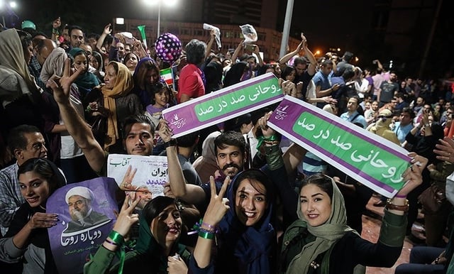 Rouhani's supporters celebrate his presidential victory on the streets of Tehran