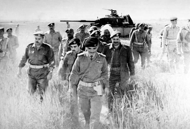 King Hussein on 21 March 1968 checking an abandoned Israeli tank in the aftermath of the Battle of Karameh.
