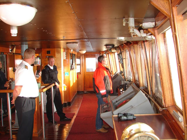 Three types of mariners, seen here in the wheelhouse of a ship: a master, an able seaman, and a harbour pilot.