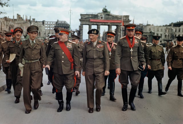 Marshals Zhukov and Rokossovsky with General Sokolovsky leave the Brandenburg Gate after being decorated by Montgomery