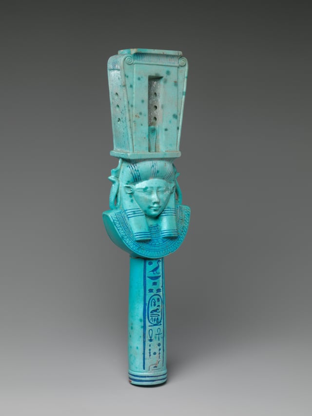 Faience sistrum with head of Hathor with bovine ears from the reign of Ptolemy I. Color is intermediate between traditional Egyptian color to colors more characteristic of Ptolemaic-era faience.