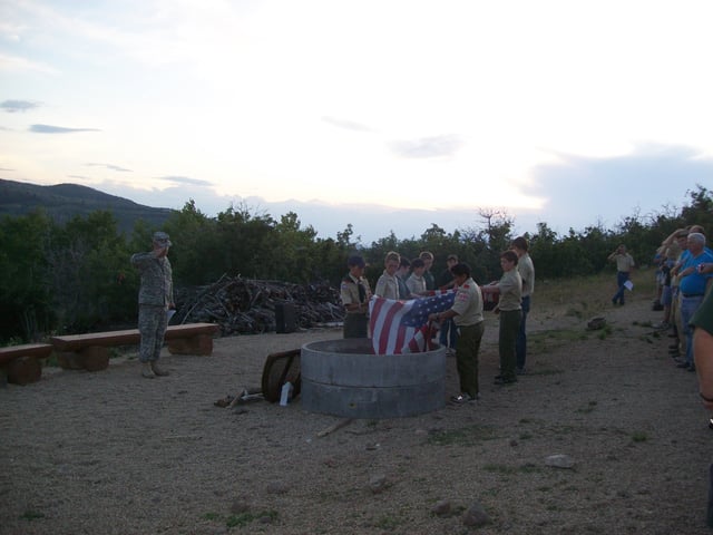 Boy Scouts retiring an American Flag at a scout campout