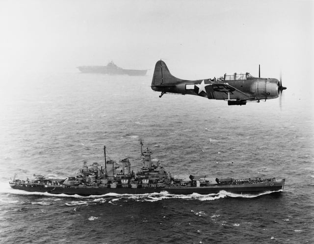 U.S. Navy SBD-5 scout plane flying patrol over USS Washington and USS Lexington during the Gilbert and Marshall Islands campaign, 1943