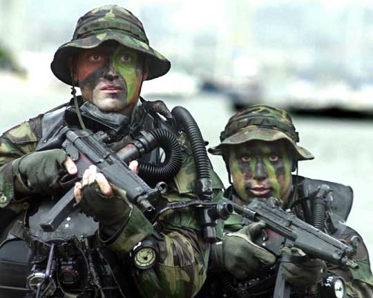 Navy SEALs training with MP5 submachine guns