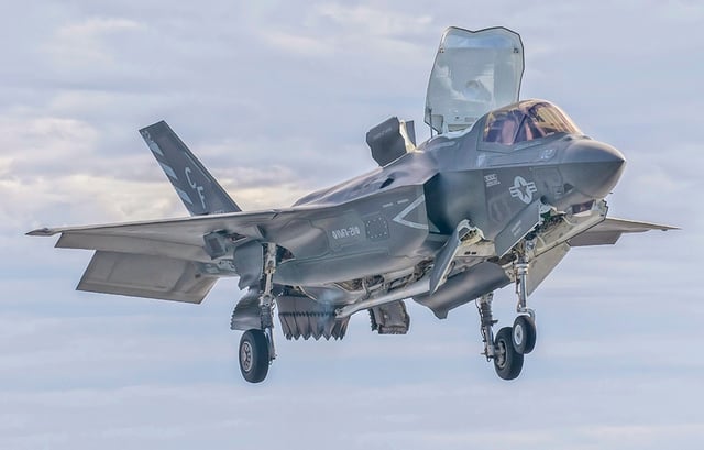 A F-35B prepares for a vertical landing on USS America