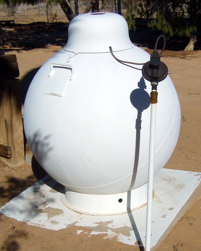Domestic spherical steel pressure vessel with a pressure regulator for propane storage in the United States. This example was installed on this property in 1974.