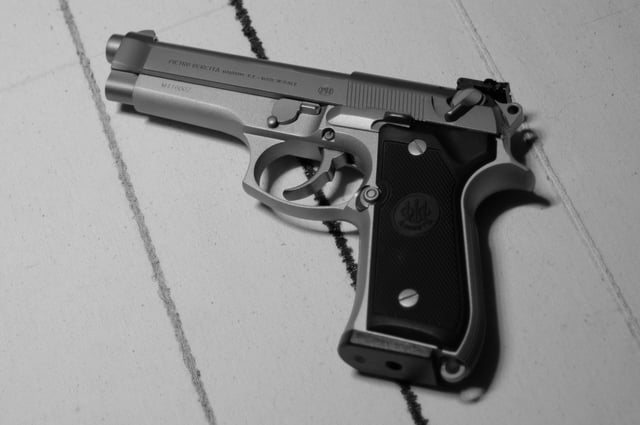 A Beretta 92FS Inox stainless steel pistol.