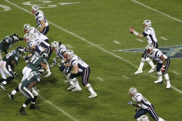 The Patriots playing against the Eagles in Super Bowl XXXIX.