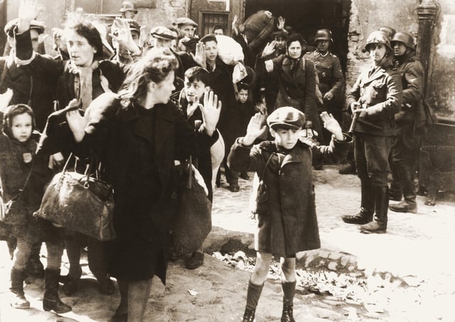 Another Stroop report image of the aftermath of the Warsaw Ghetto Uprising; the SS man on the right with the gun is Josef Blösche.
