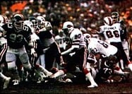 Bills' running back Joe Cribbs (middle) rushes the ball against the Jets in the 1981 AFC Wild Card game.