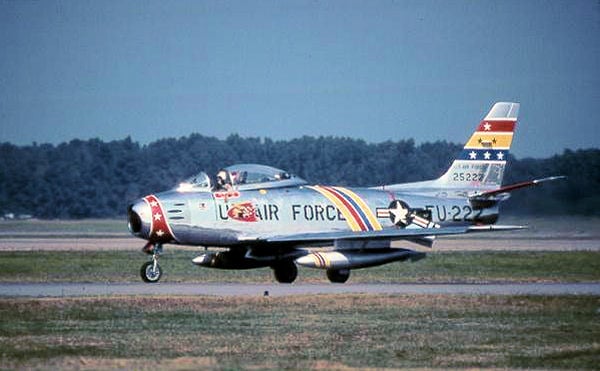 North American F-86F-35-NA Sabre Serial 52-5222 of the 72d Fighter-Bomber Squadron. The aircraft has been restored and is painted in the Wing Commander's motif, with blue, yellow and red striping.