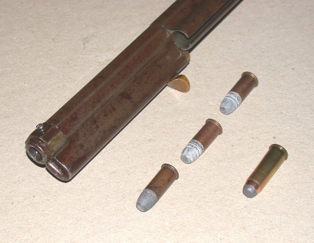 Loading sleeve open, three Henry Flat cartridges, compare with.44 WCF round