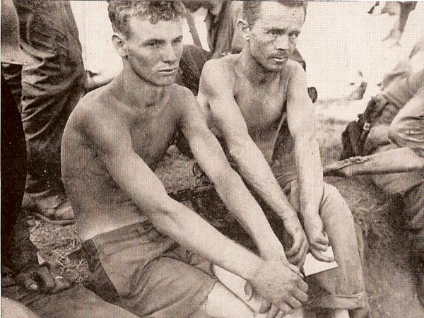 Two Hill 303 survivors after being rescued by US units, 17 August 1950