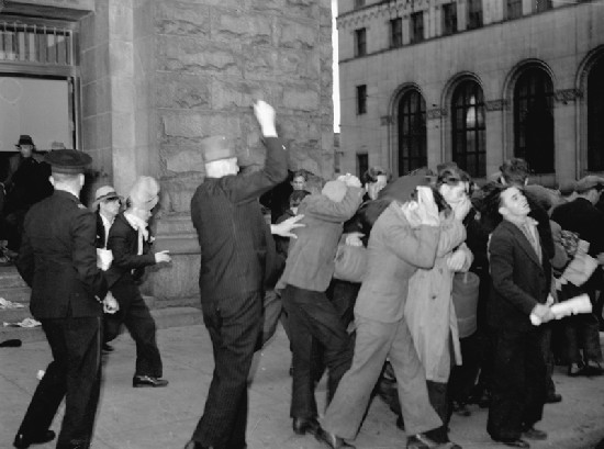 Plainclothes RCMP officers attack Relief Camp Workers' Union protesters in 1938. Several protests over unemployment occurred in the city during the Great Depression.