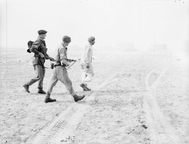 Troops of the Parachute Regiment escort a captured Egyptian soldier at Port Said