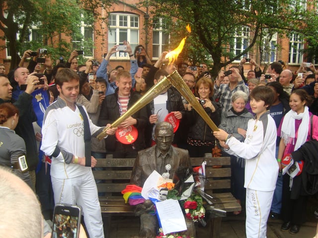 The London 2012 Olympic Torch flame was passed on in front of Turing's statue in Manchester on his 100th birthday.