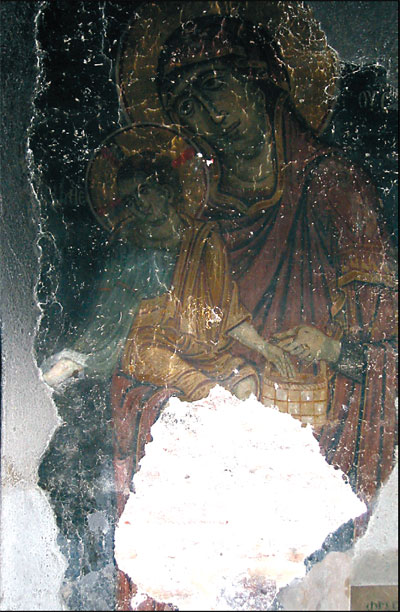 A photograph of the famous fresco Bathing of the Christ, after being vandalized by a Kosovo Albanian mob during the 2004 unrest in Kosovo