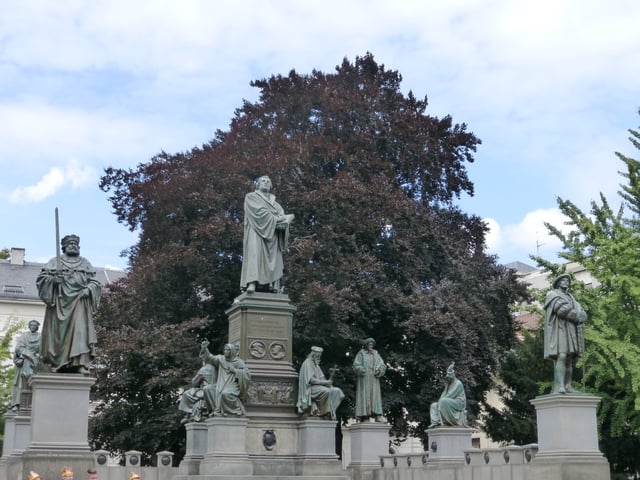Luther Monument in Worms. His statue is surrounded by the figures of his lay protectors and earlier Church reformers including John Wycliffe, Jan Hus and Girolamo Savonarola.