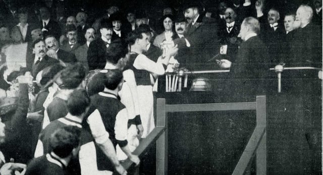 King George V presents the FA Cup trophy to Tommy Boyle of Burnley F.C., April 1914
