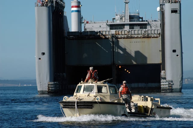 US Navy 050728-N-8268B-022 A Logistical Amphibious Recovery Craft (LARC) amphibious vehicle assigned to Beachmaster Unit One (BMU-1) launches from the Military Sealift Command (MSC) sea barge heavy lift ship SS Cape Mohican (T-AKR-5065)