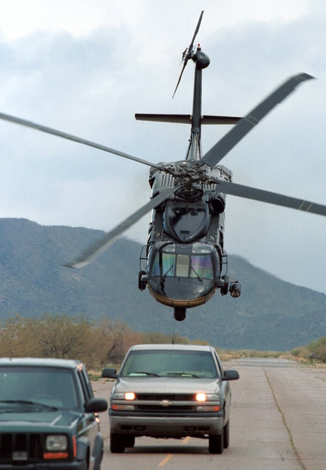 An Air and Marine Operations (AMO) UH-60 Black Hawk supporting an HSI operation