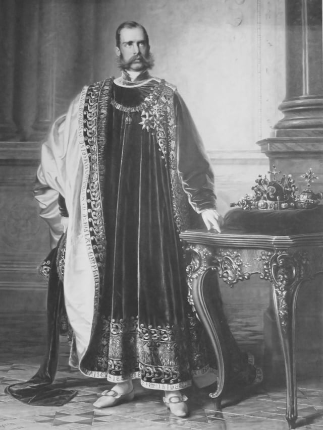 Franz Joseph in the regalia of the Order of the Golden Fleece, with the Bohemian Crown Jewels next to him. Painting by Eduard von Engerth for the Bohemian Diet, 1861.