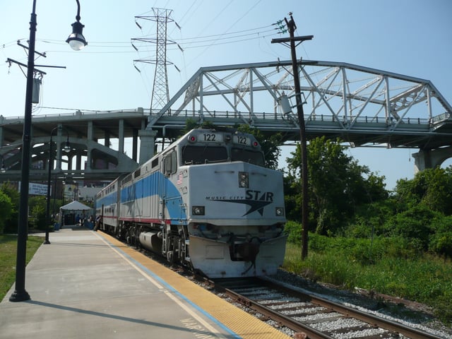 A Music City Star commuter train beneath the Shelby Street Bridge