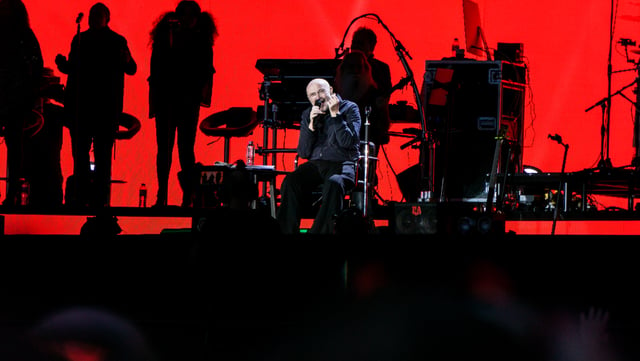 Collins performing to 65,000 at Hyde Park, London on 30 June 2017. Music critic Neil McCormick wrote, “He could barely walk but Phil Collins still knocked it out of Hyde Park“.