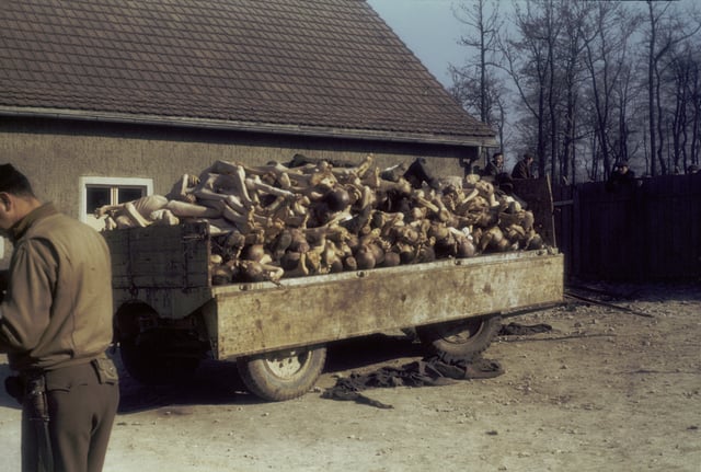A wagon piled high with corpses outside the crematorium at the recently liberated Buchenwald concentration camp, 1945
