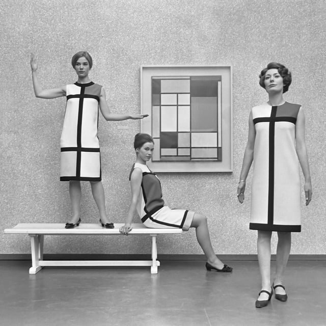 Mondrian dresses by Yves Saint Laurent shown with a Mondrian painting in 1966.