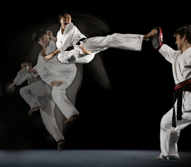 Steven Ho executing a Jump Spin Hook Kick