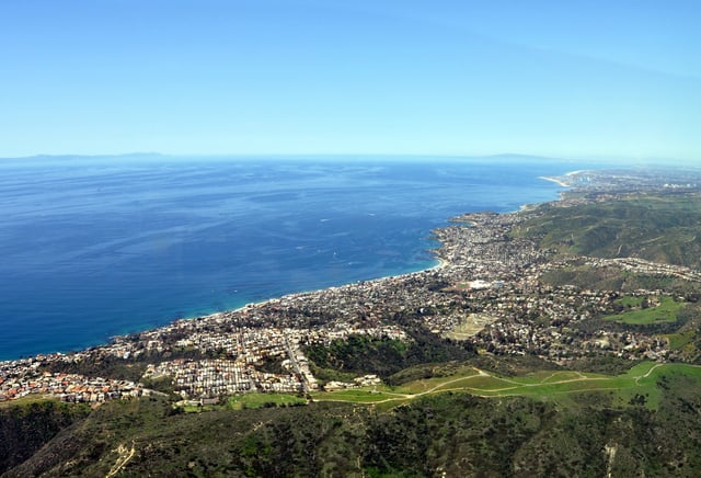 Laguna Beach (with Newport beach in background). Laguna beach is part of Orange county