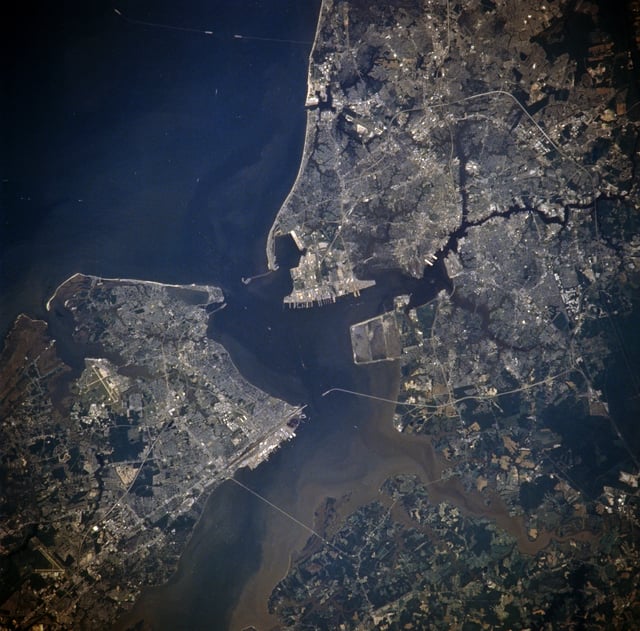 Newport News, Hampton, Isle of Wight County, Suffolk, Chesapeake, Portsmouth and Norfolk, Virginia from space, July 1996. Norfolk is located in the upper right quadrant, and east is at the top.