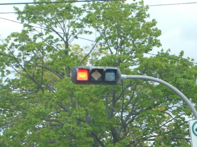 A traffic signal in Halifax, Nova Scotia, Canada, with specially shaped lights to assist people with colour blindness