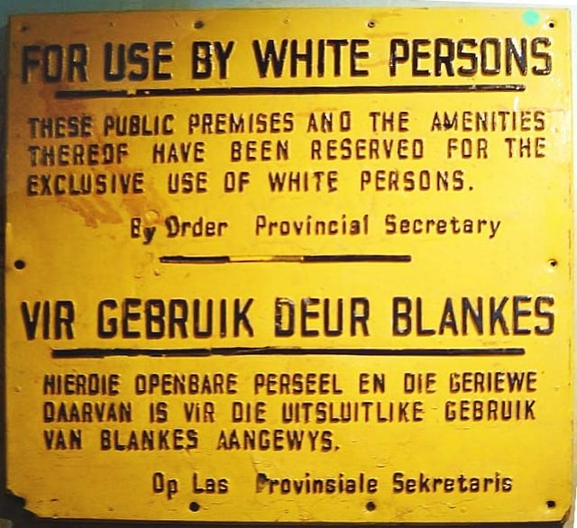 "For use by white persons" – apartheid sign in English and Afrikaans