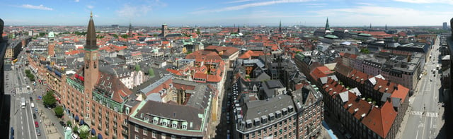 The city skyline features many towers and spires