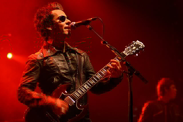 Jones playing his Cherry Red Gibson SG.