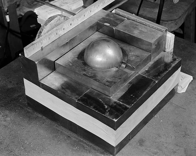 A sphere of simulated plutonium surrounded by neutron-reflecting tungsten carbide blocks in a re-enactment of Harry Daghlian's 1945 experiment